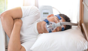 man-with-sleep-apnea-and-cpap-mask